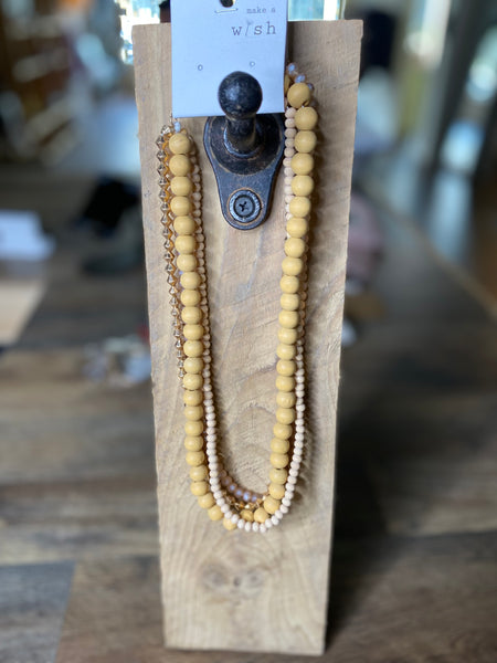 Layered Wooden Beaded Necklace Featuring Gold Accents